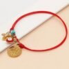 Pulsera roja con cruz, mano de fatima y ojo turco