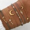 Pulsera gris con luna y estrellas