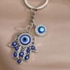 Llavero dorado diseno mano de fatima y ojo turco