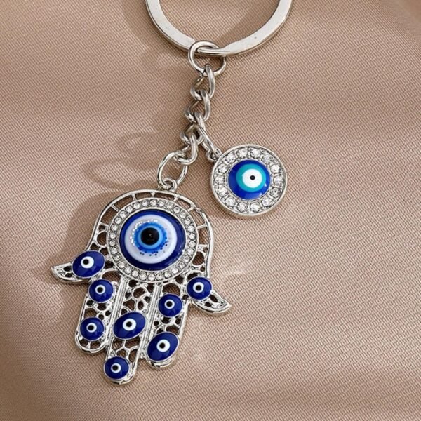 Llavero dorado diseno mano de fatima y ojo turco