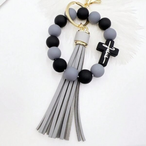 Llavero de piedras azules con cruz negro y gris