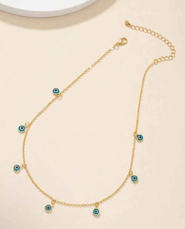 Collar dorado con dijes de ojo turco